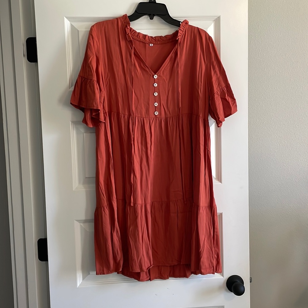 Short sleeve dress. Size M Burnt Orange. Never worn. Boutique dress